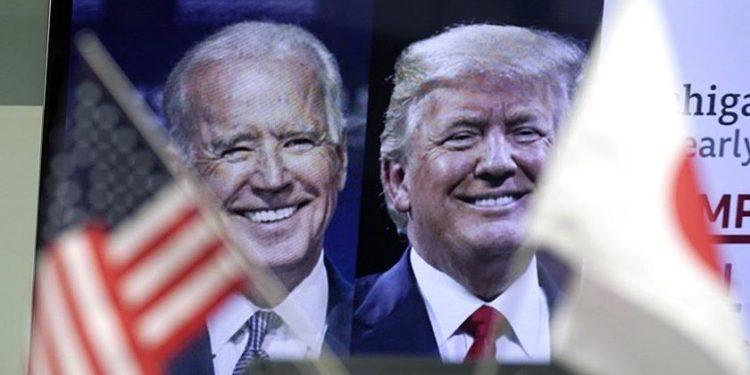Τζο Μπάιντεν και Ντόναλντ Τραμπ. Φωτογραφία αρχείου: AP Photo/Eugene Hoshiko